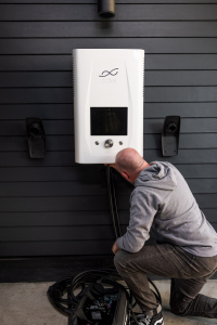 Picture of an electrical contractor installing a charging station