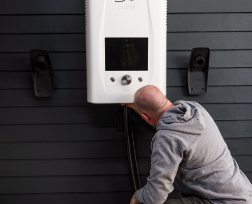 Picture of an electrical contractor installing a charging station